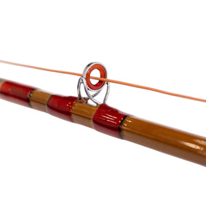 Fly line running through the stripping guide of a bamboo rod