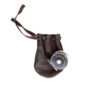 Clark Fork fly reel with its leather drawstring pouch